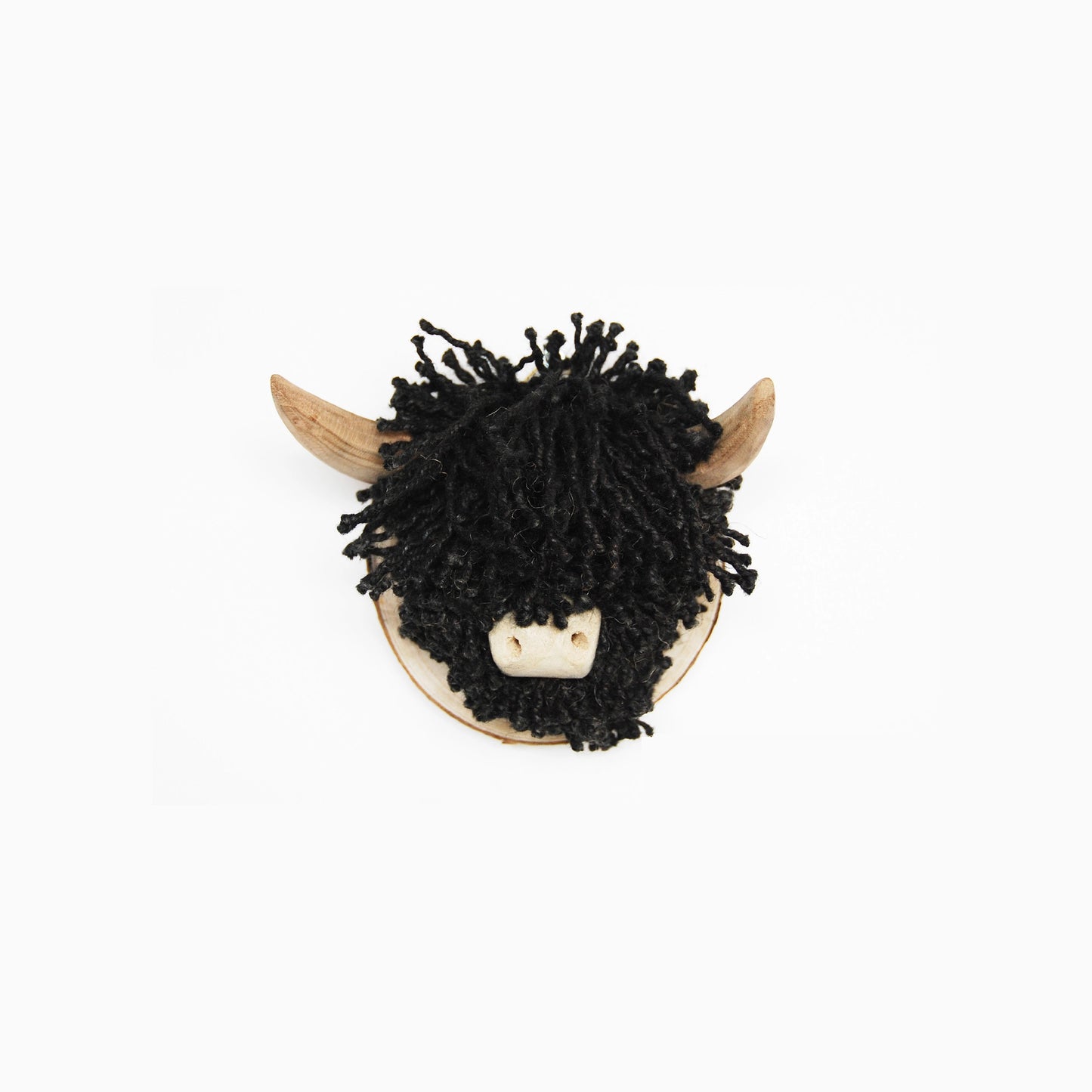A plaque mounted wall mounted cow head with black jute twine hair