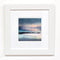 A framed square print featuring artwork by Cath Waters