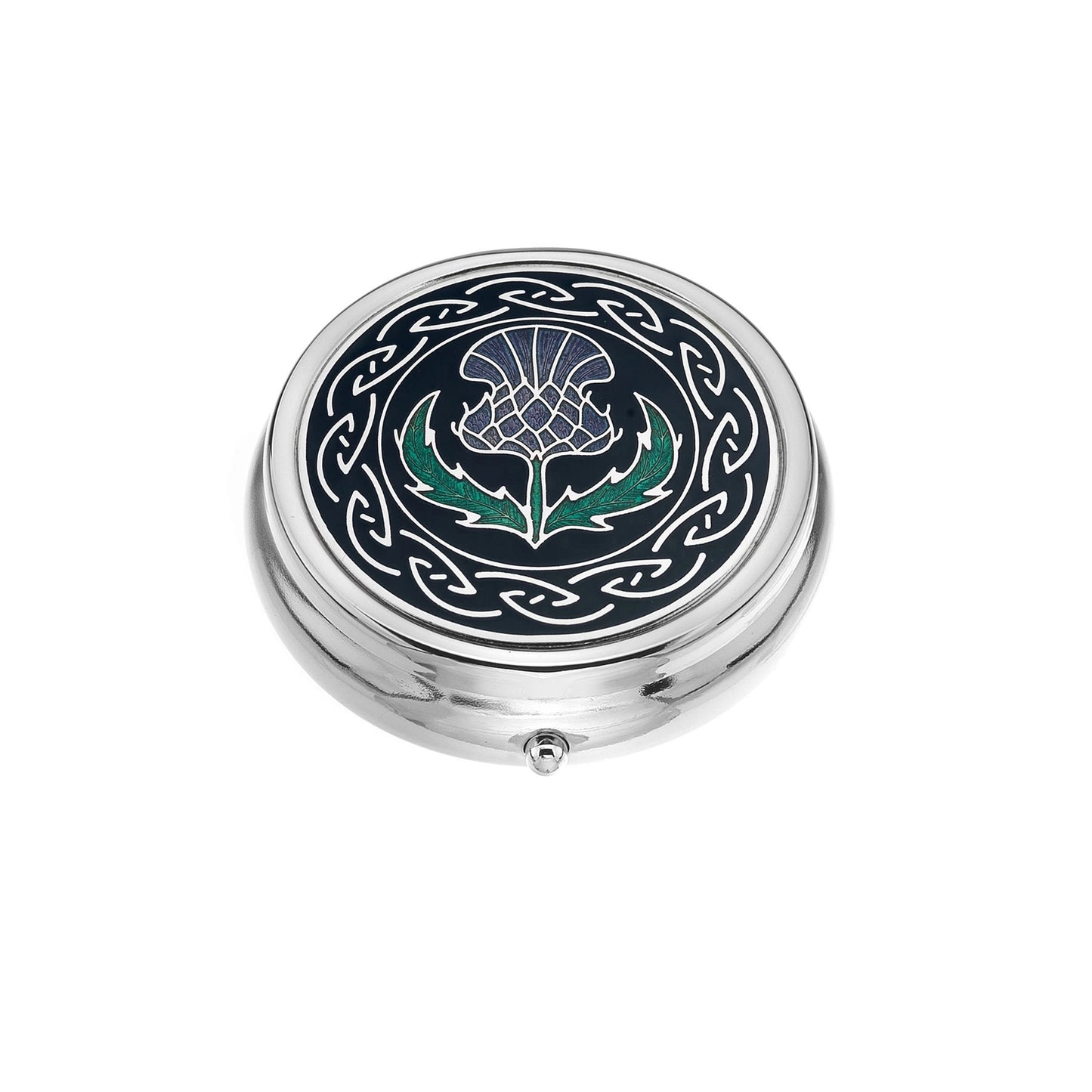 A silver pill box with enamel top featuring detailed Scottish thistle and Celtic frame design