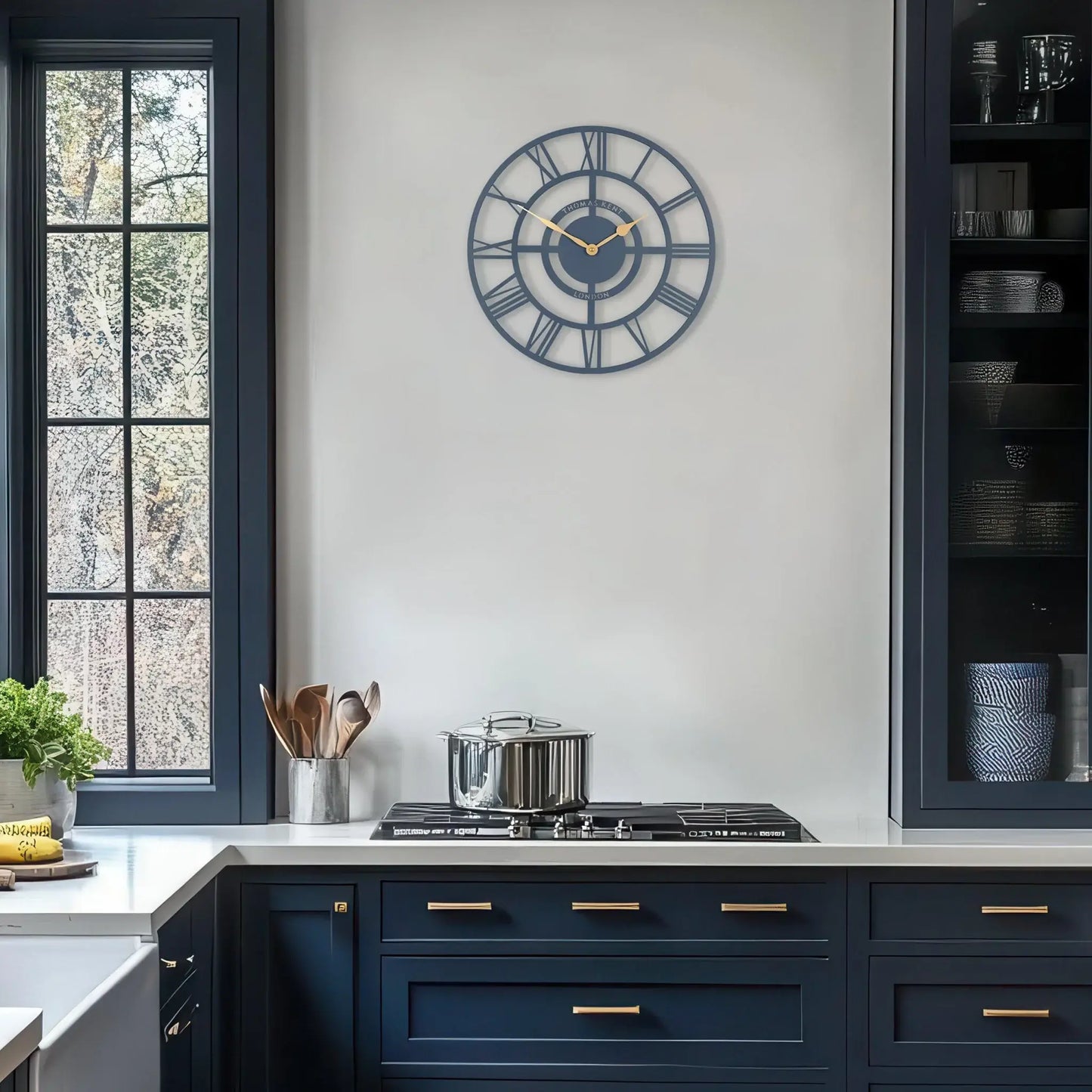 Skeleton wall clock in blue with gold hands lifestyle