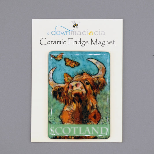 A rectangular fridge magnet featuring a Highland cow and butterfly with 'Scotland' on the bottom