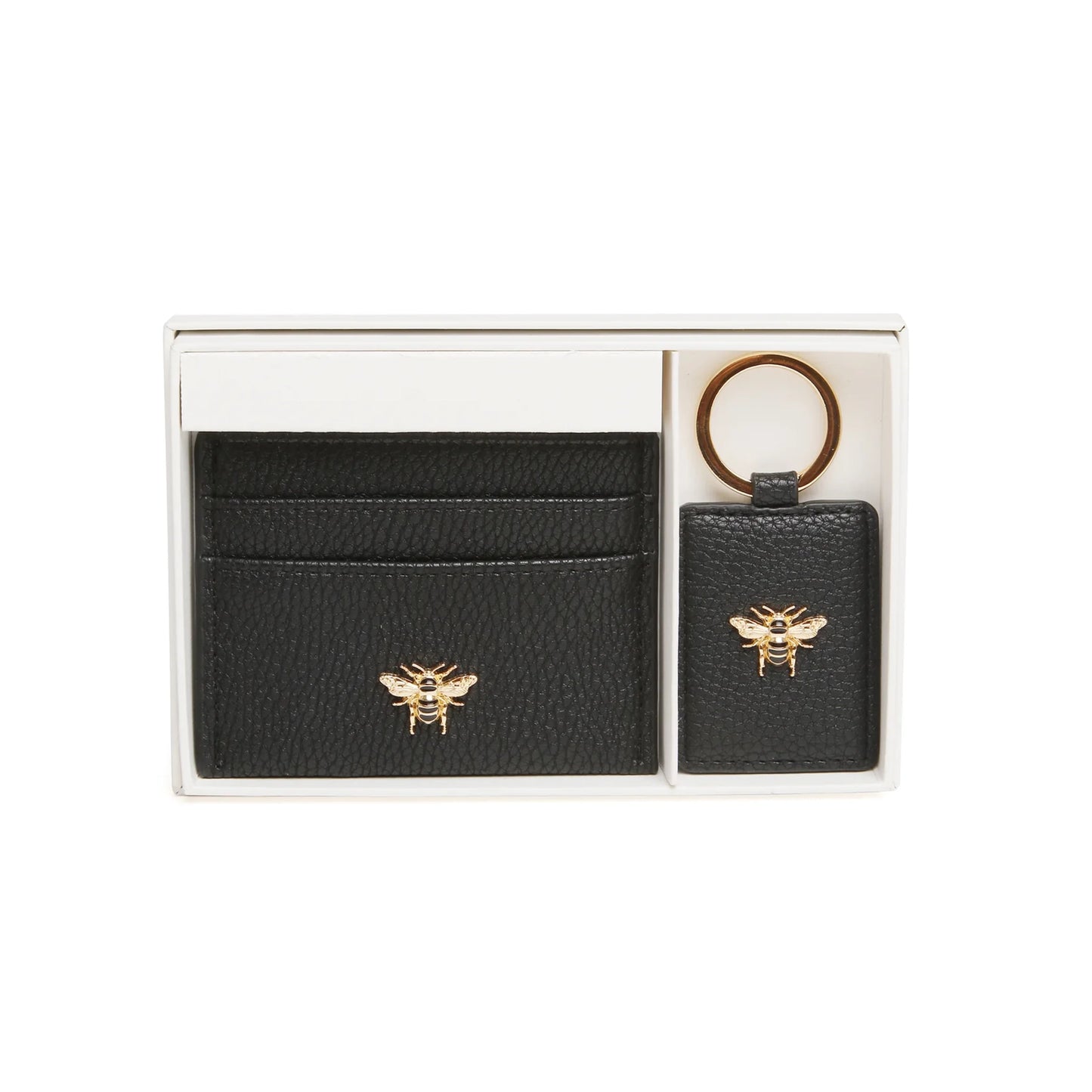 A gift set with a card holder and keyring in black faux leather with metal bee emblem deatils