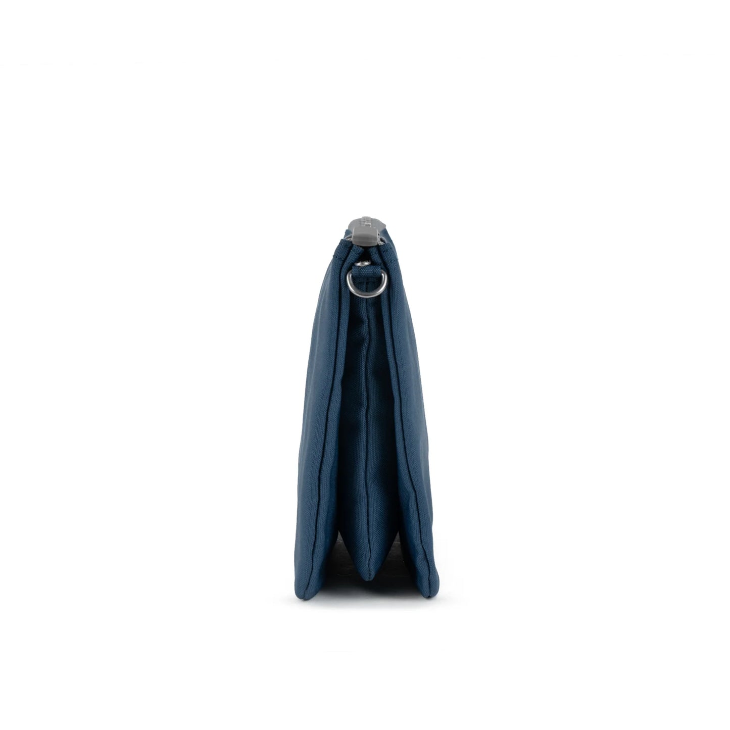 Side of a canvas bag in a dark blue colour with removable cross-body strap