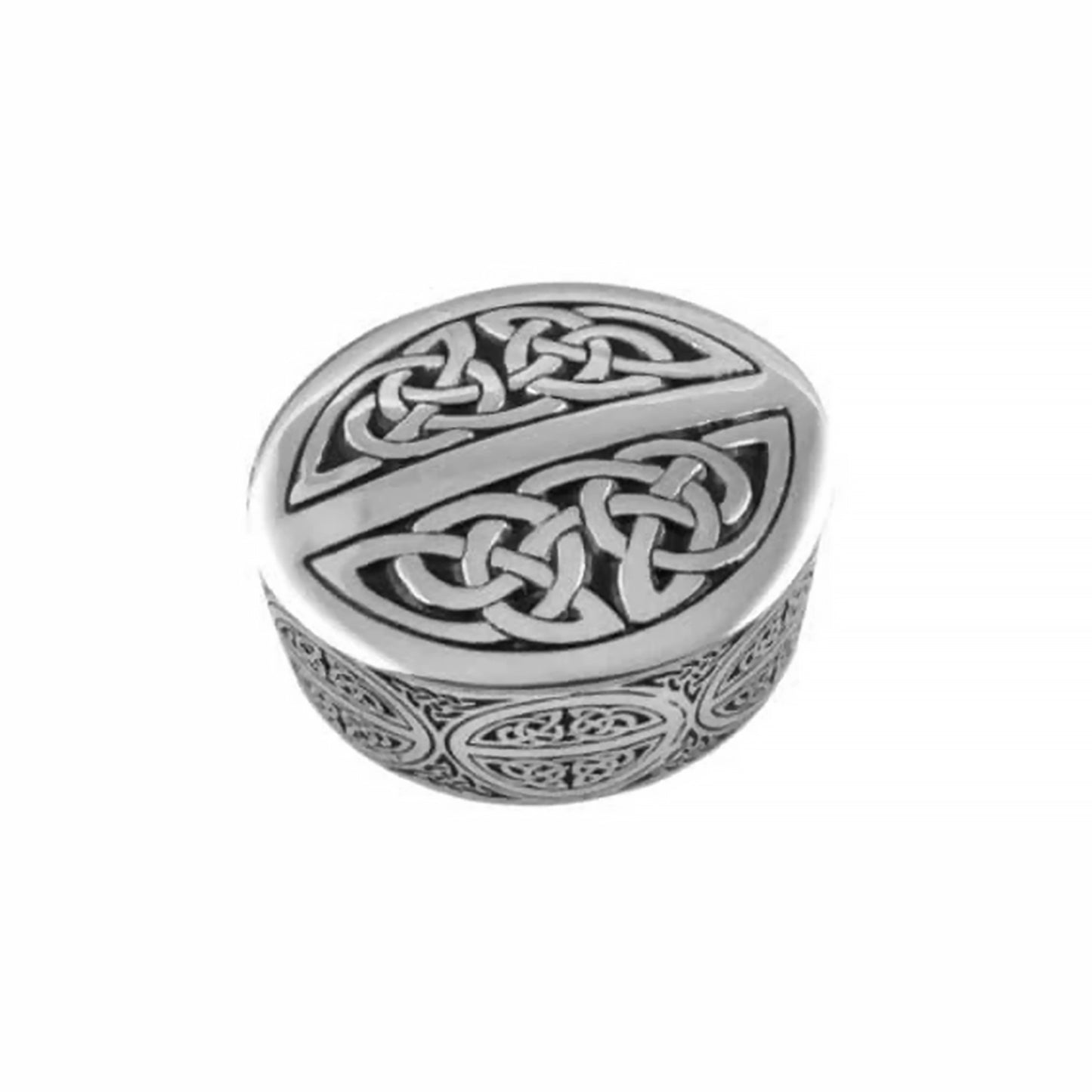 An oval shaped trinket box made of pewter and decorated with Celtic designs