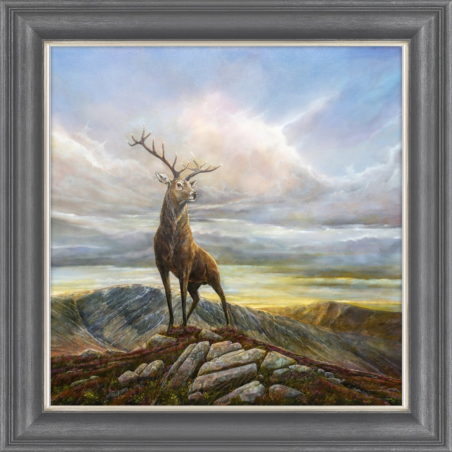 A framed print of a painting of a stag