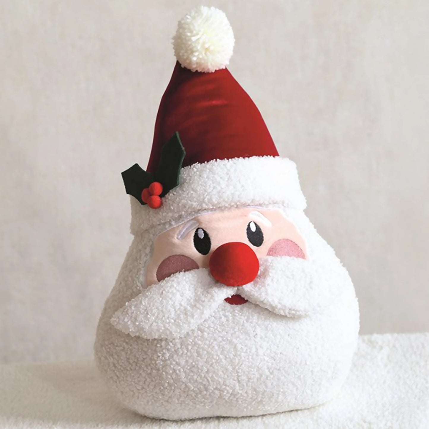 Santa head shaped cushion with rosy cheeks, hat and boucle beard