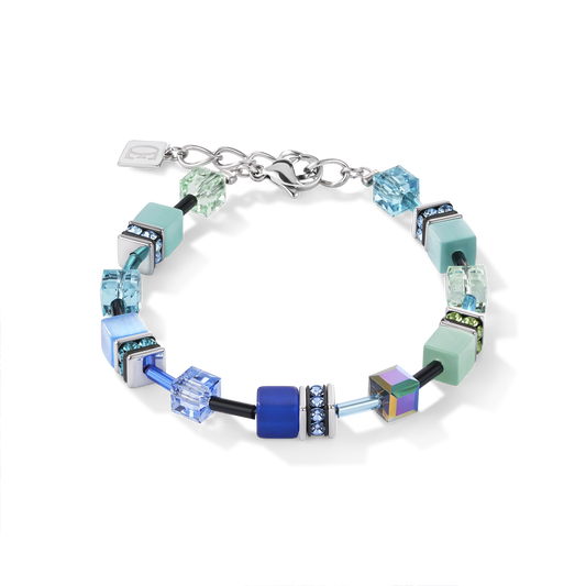 A bracelet featuring a variety of cube shaped stones and Swarovski crystals in blue and green colours