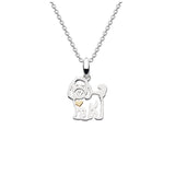 A silver pendant with a cockapoo and gold heart
