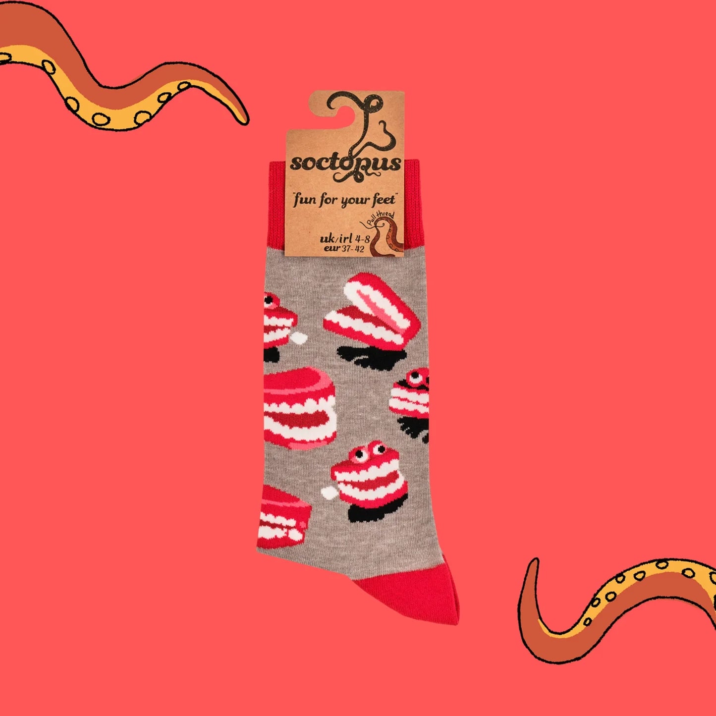 Pair of grey and red joke socks with dentures design
