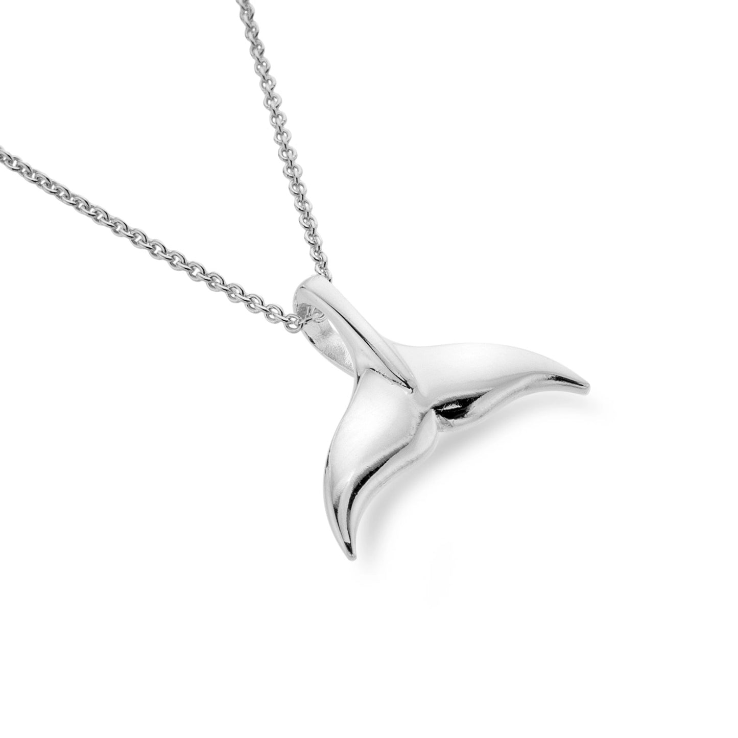 A silver pendant shaped like a dolphin tail