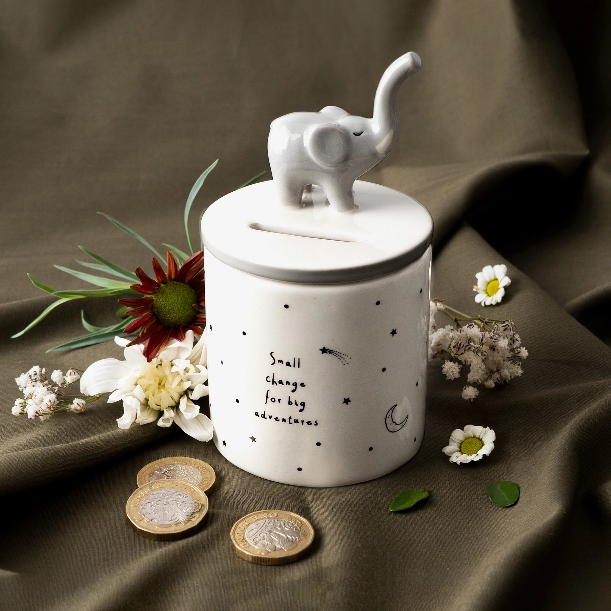 A ceramic cylinder money pot with elephant and star design lifestyle