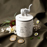 A ceramic cylinder money pot with elephant and star design lifestyle