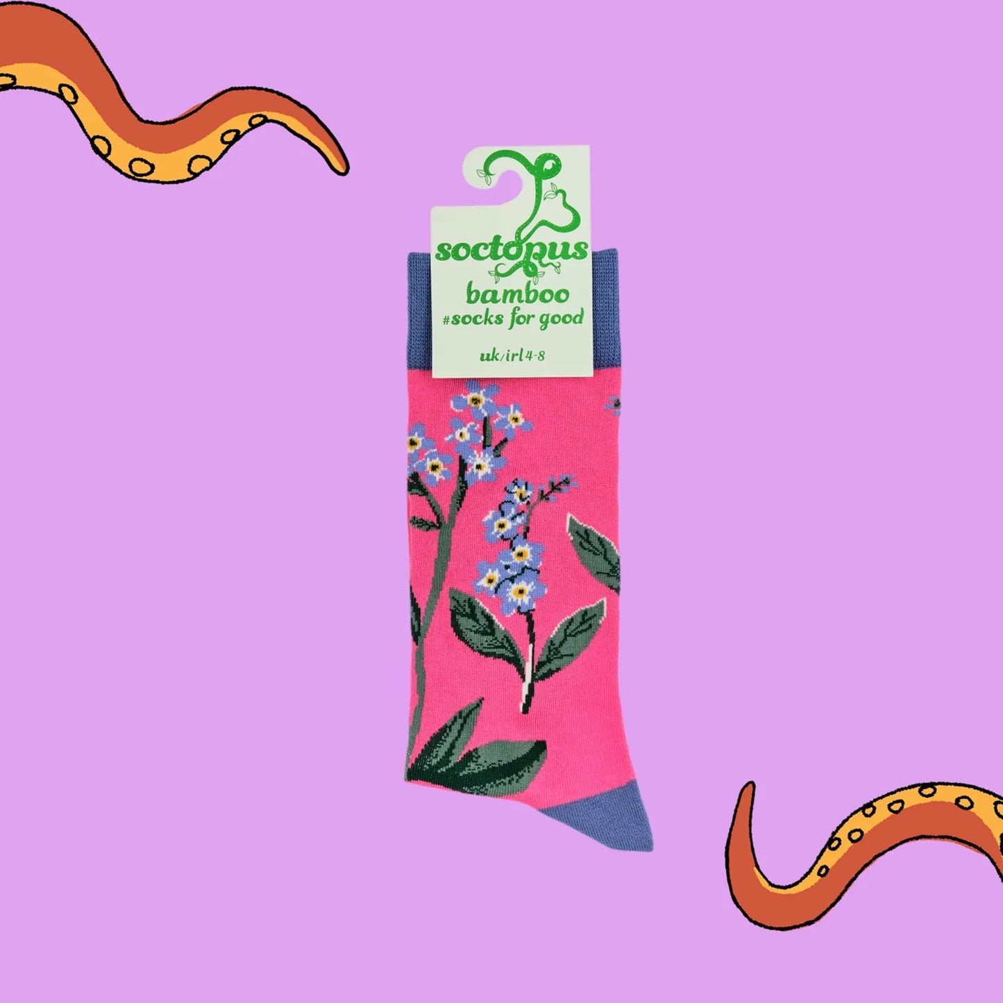 Pair of bright pink forget me not floral design bamboo socks