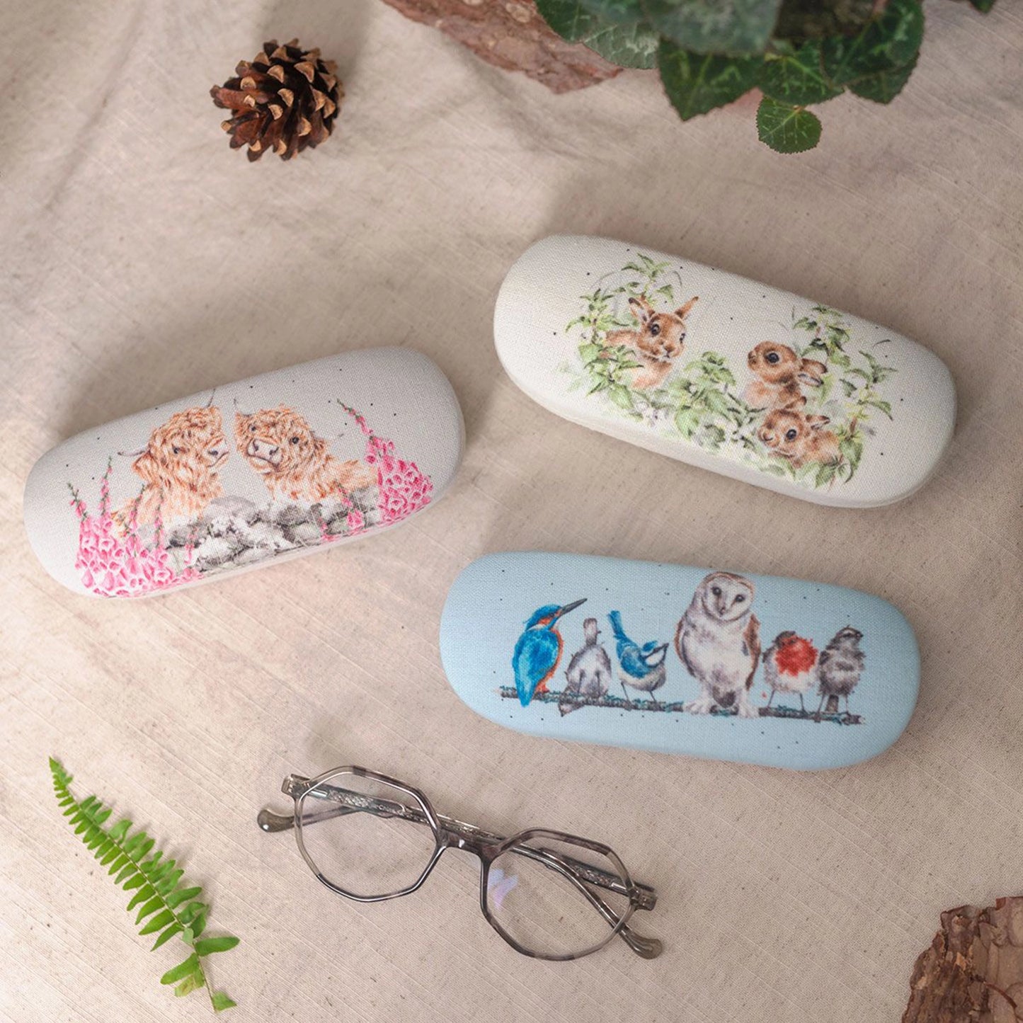 Grey canvas glasses case with Highland cow illustration lifestyle