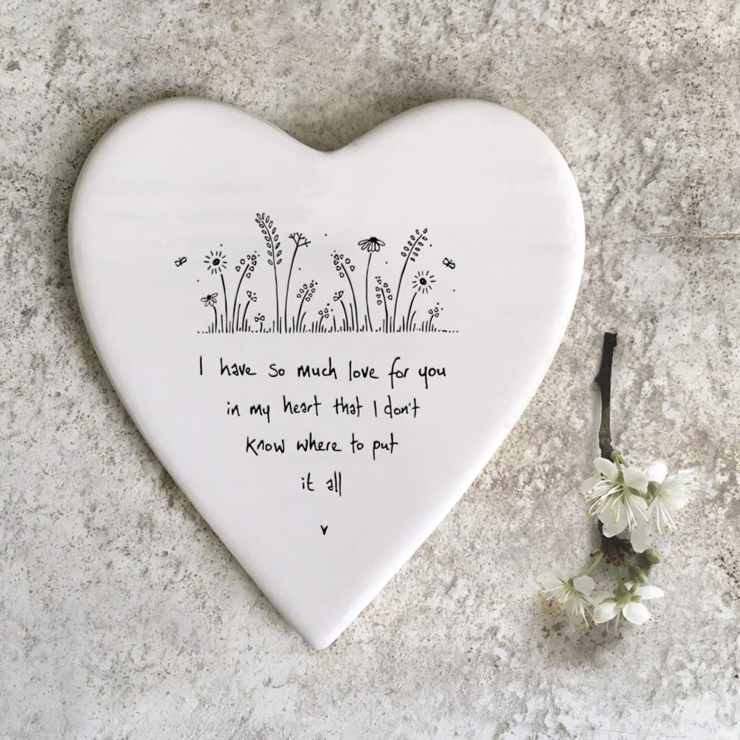 Ceramic heart shaped coaster with flowers and phrase design
