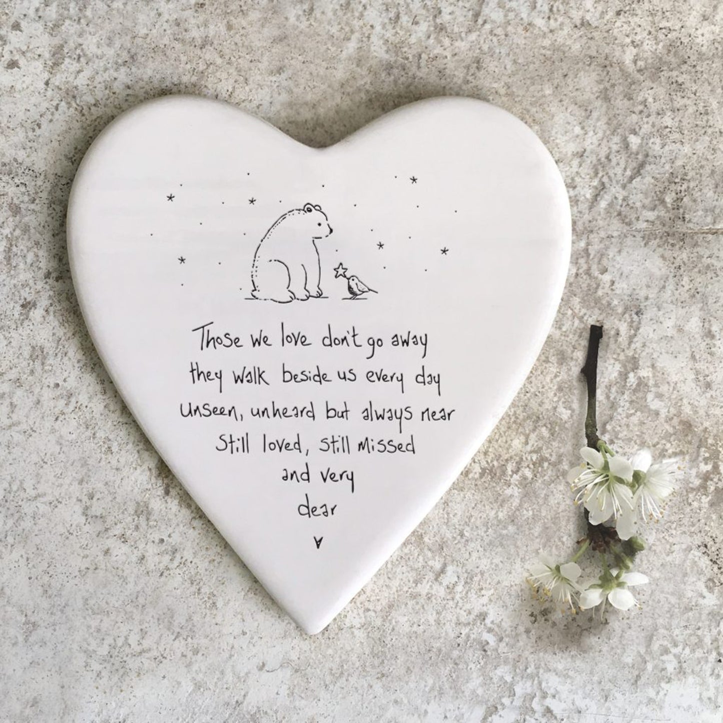 Ceramic heart shaped coaster with a bear and bird design, finished with a phrase