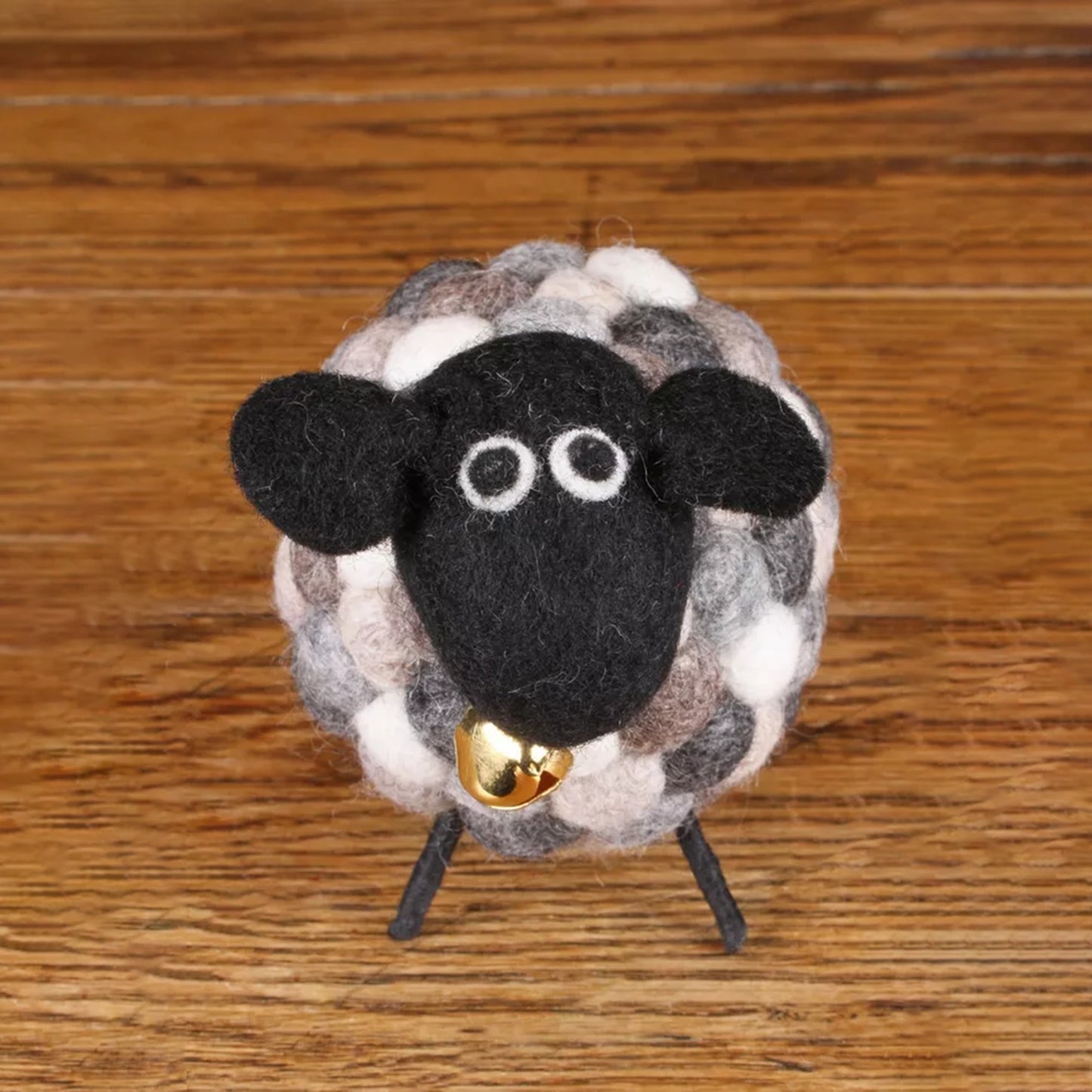 Wool figure of a grey sheep with bell
