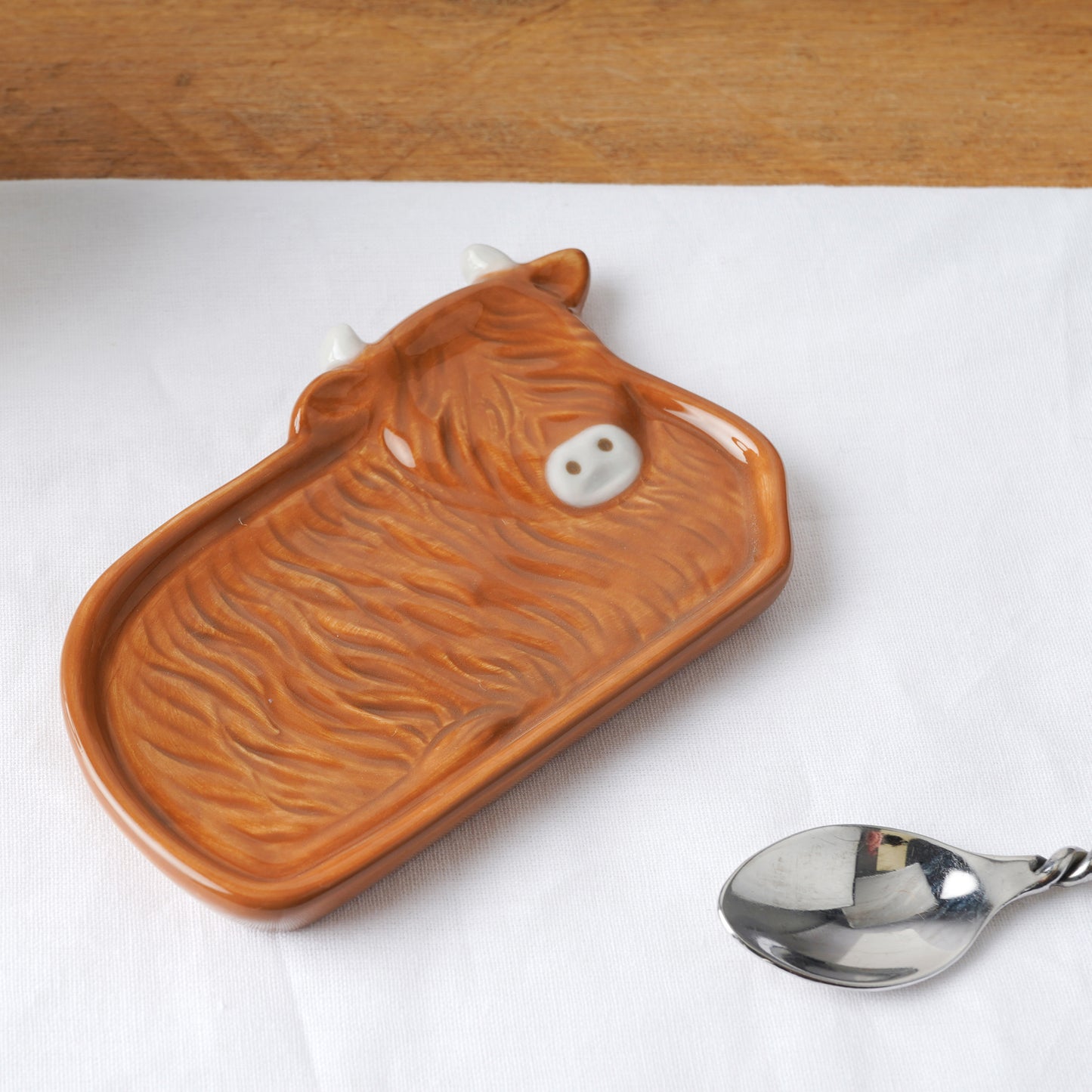 Ceramic teabag tidy shaped like a Highland cow