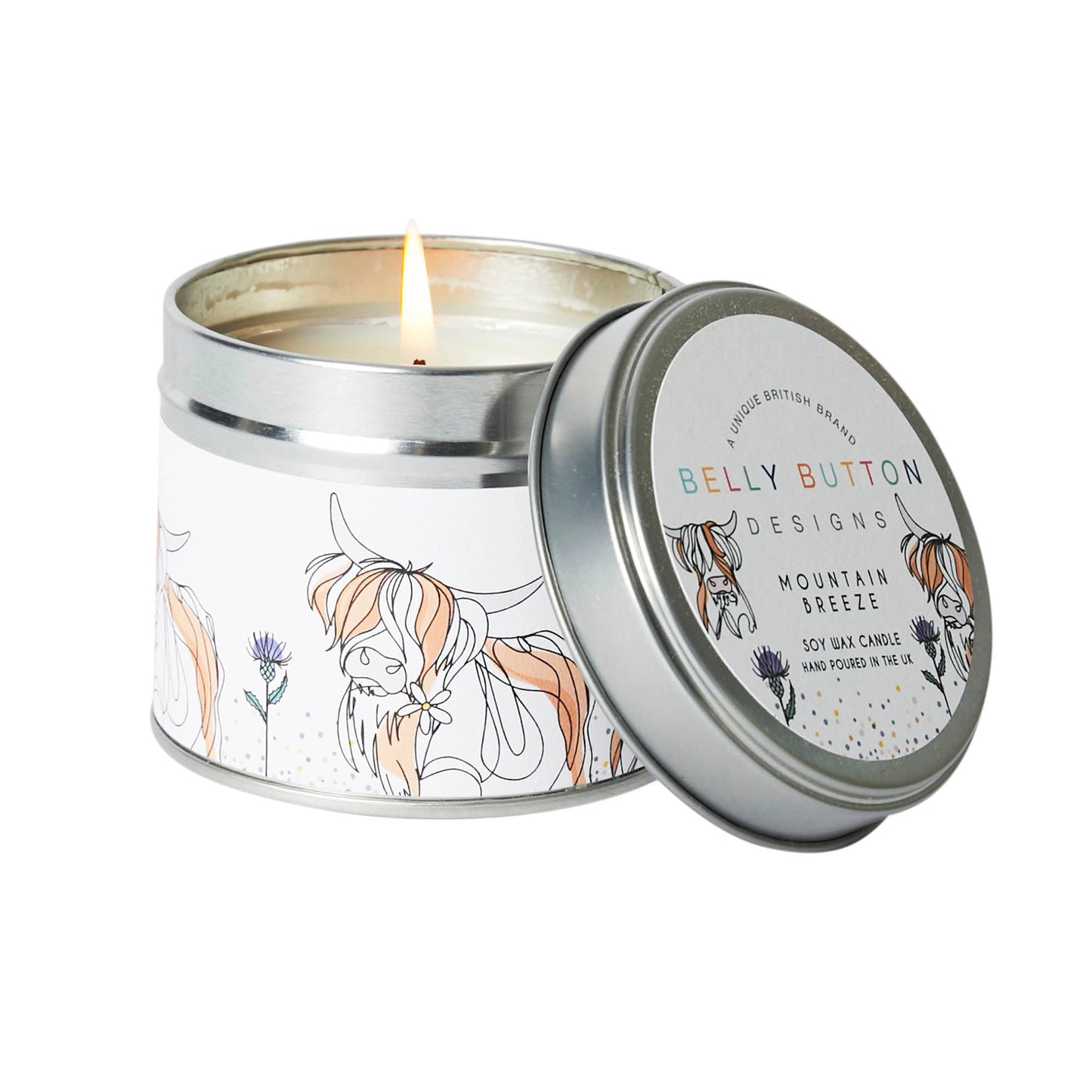 A tin candle with Highland cow and thistle print