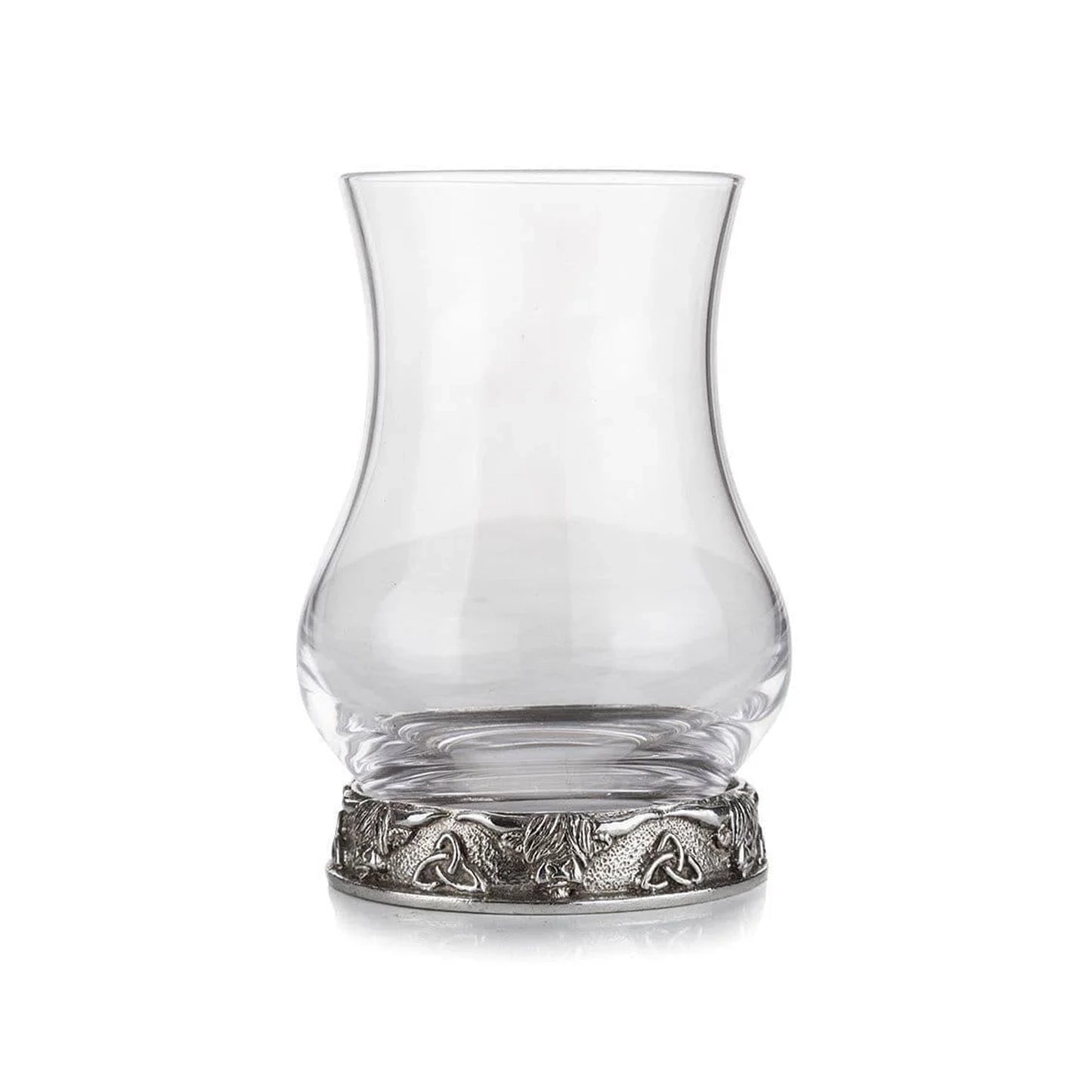 A whisky glass with a pewter base decorated with Highland cows and trinity knots