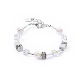 A steel bracelet featuring white pearls and cube beads