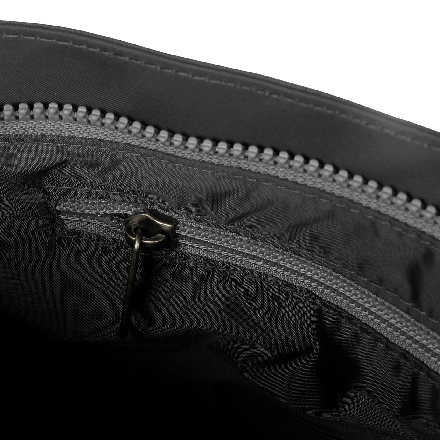 Grey nylon interior zip of crossbody bag