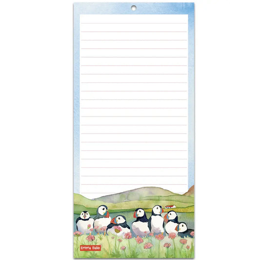 A notepad with an illustration of puffins on a landscape at the bottom