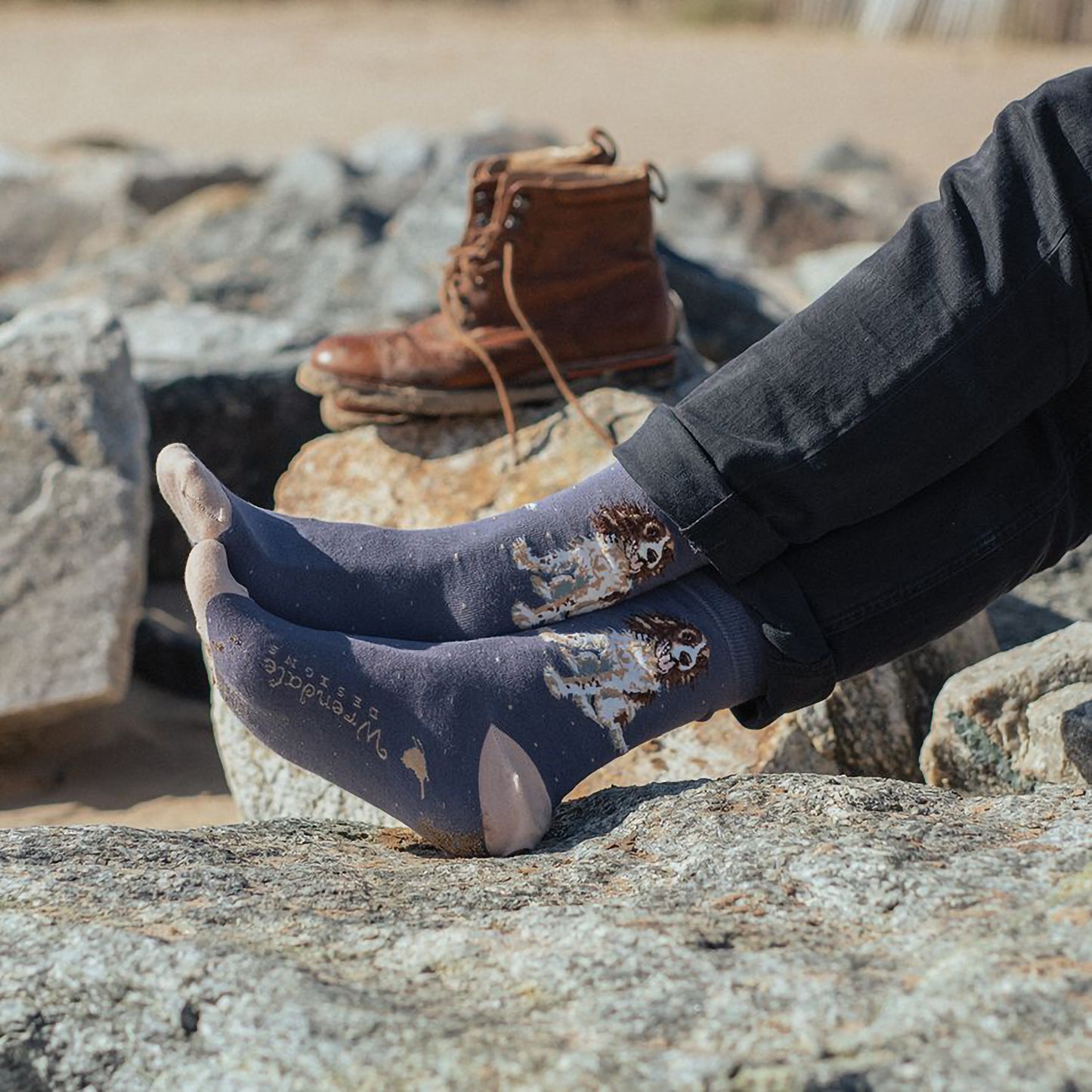 Model wearing a pair of grey socks with beige heels and polka dots with a spaniel dog picture