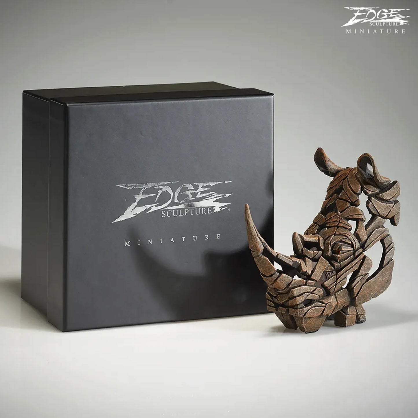 Rhinoceros bust sculpture in brown with braded box