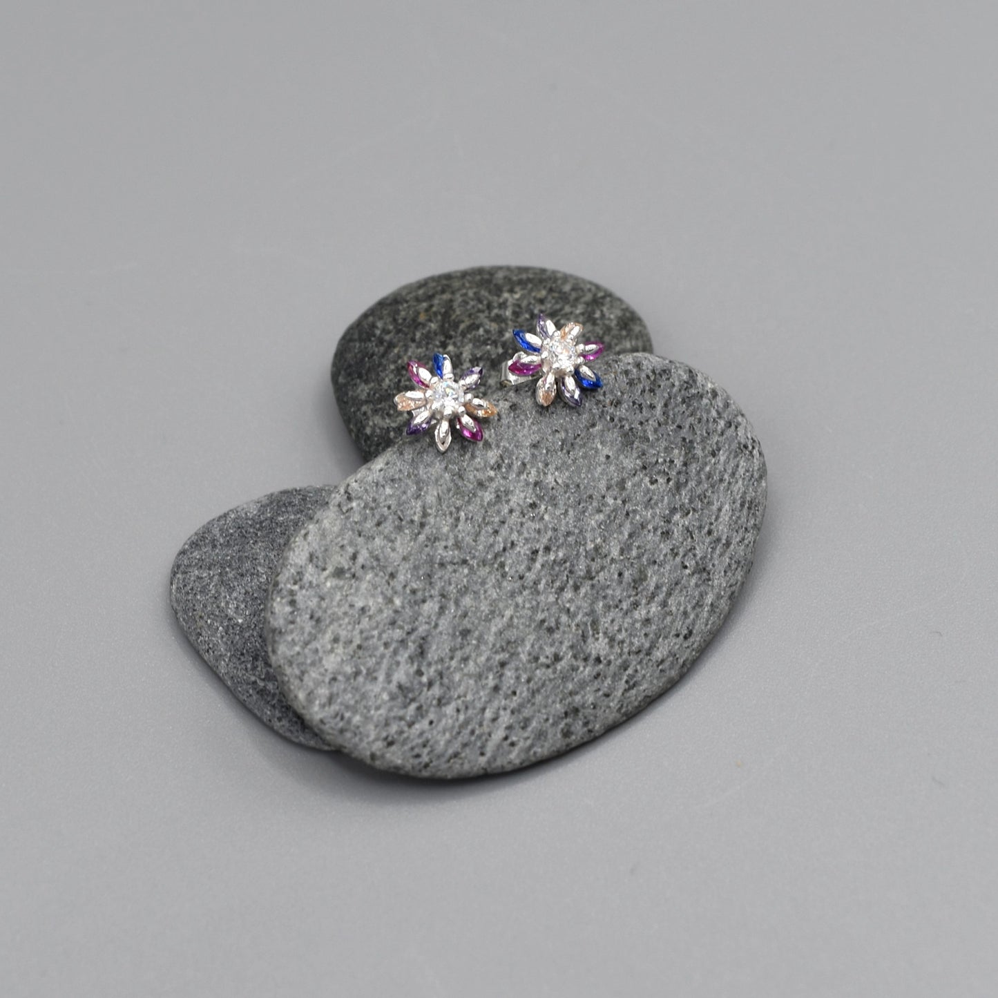 Silver star flower shaped stud earrings with multicolour CZ stone petals