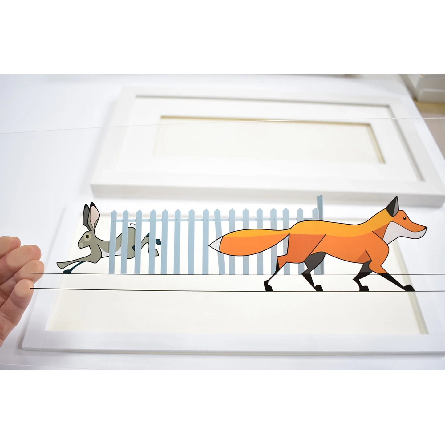 Acrylic art sheet featuring a hare escaping a fox behind a fence