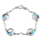 Silver link bracelet with wavey silver bars and round ocean wave pendants and blue enamel