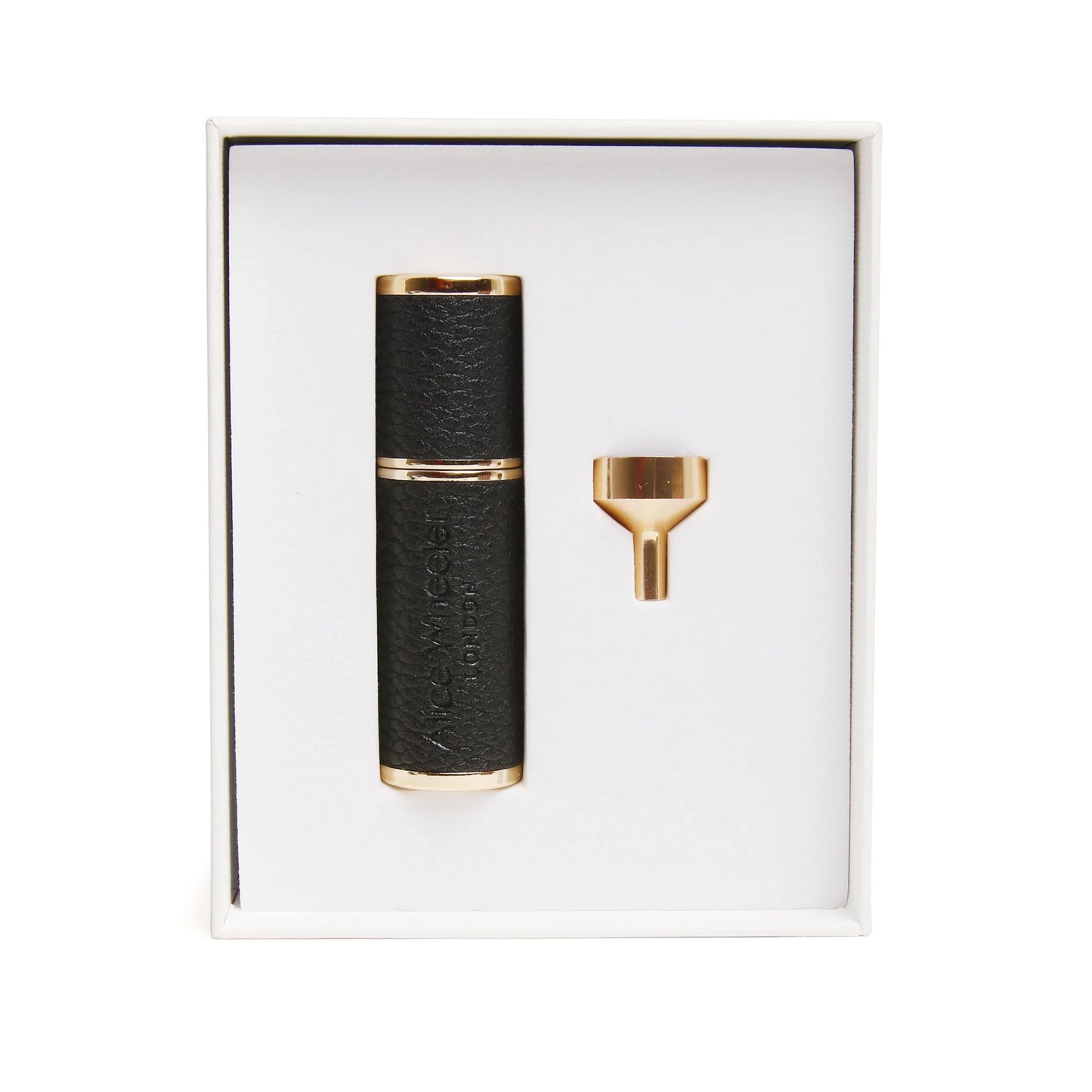 A compact atomizer with gold metal wrapped in black faux leather