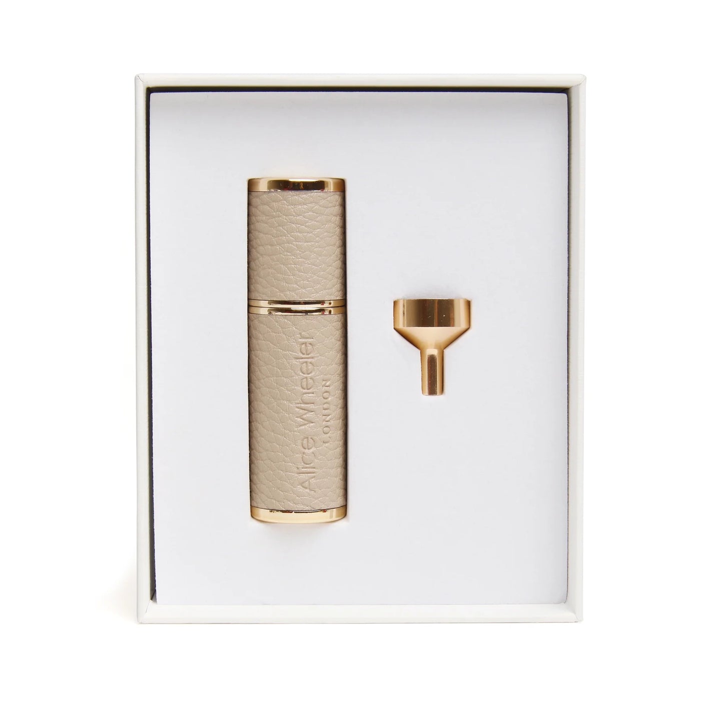 A compact atomizer with gold metal wrapped in stone faux leather