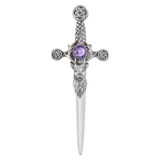 A pewter kilt pin shaped like a sword with a stag head detail and faceted round purple stone