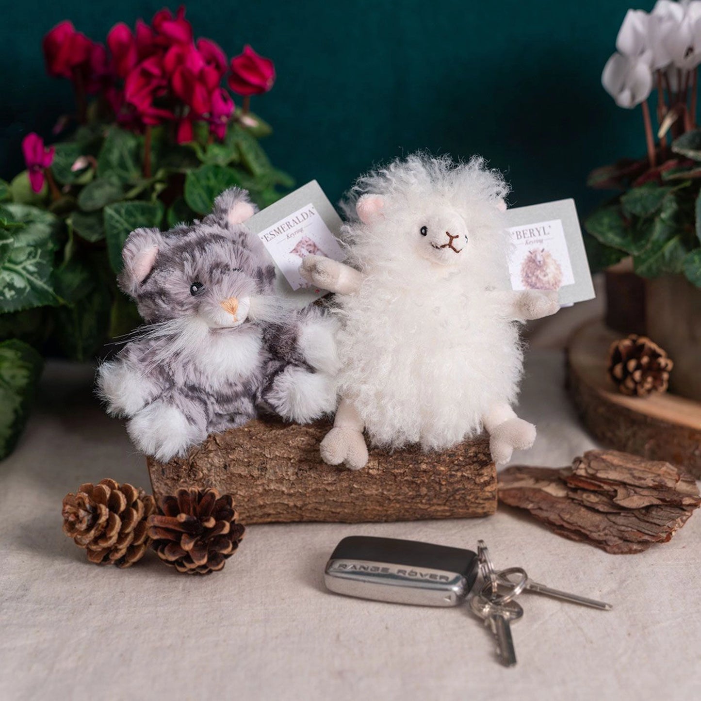White plush sheep and stripey grey cat keyrings