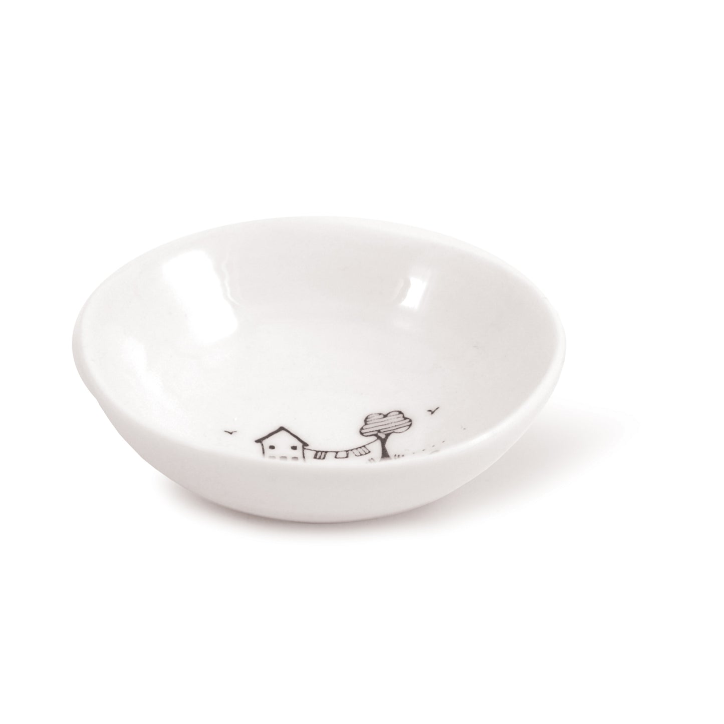 A white ceramic trinket bowl featuring a house & tree illustration and a quote side
