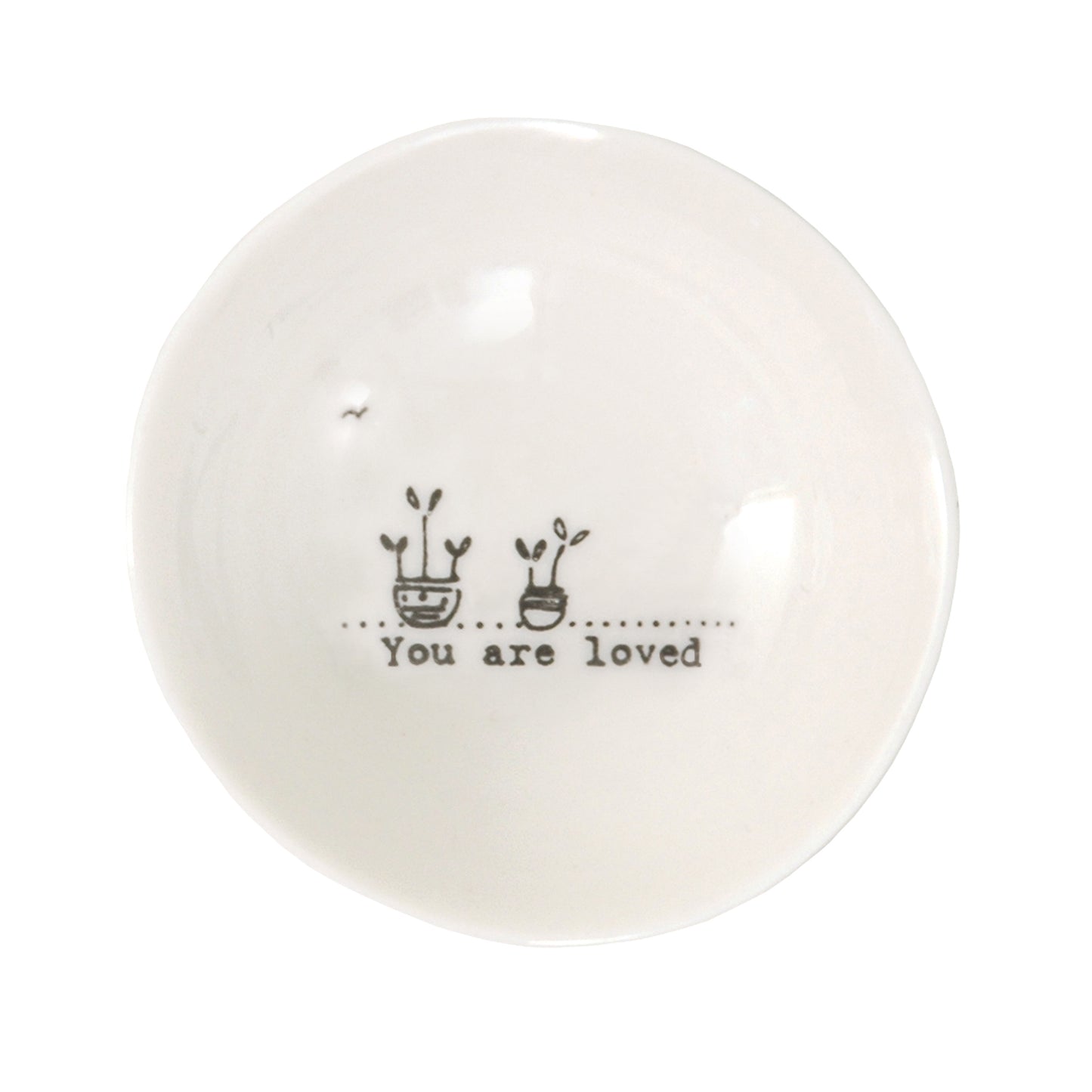 A white ceramic trinket bowl featuring a plant pot illustration and a quote