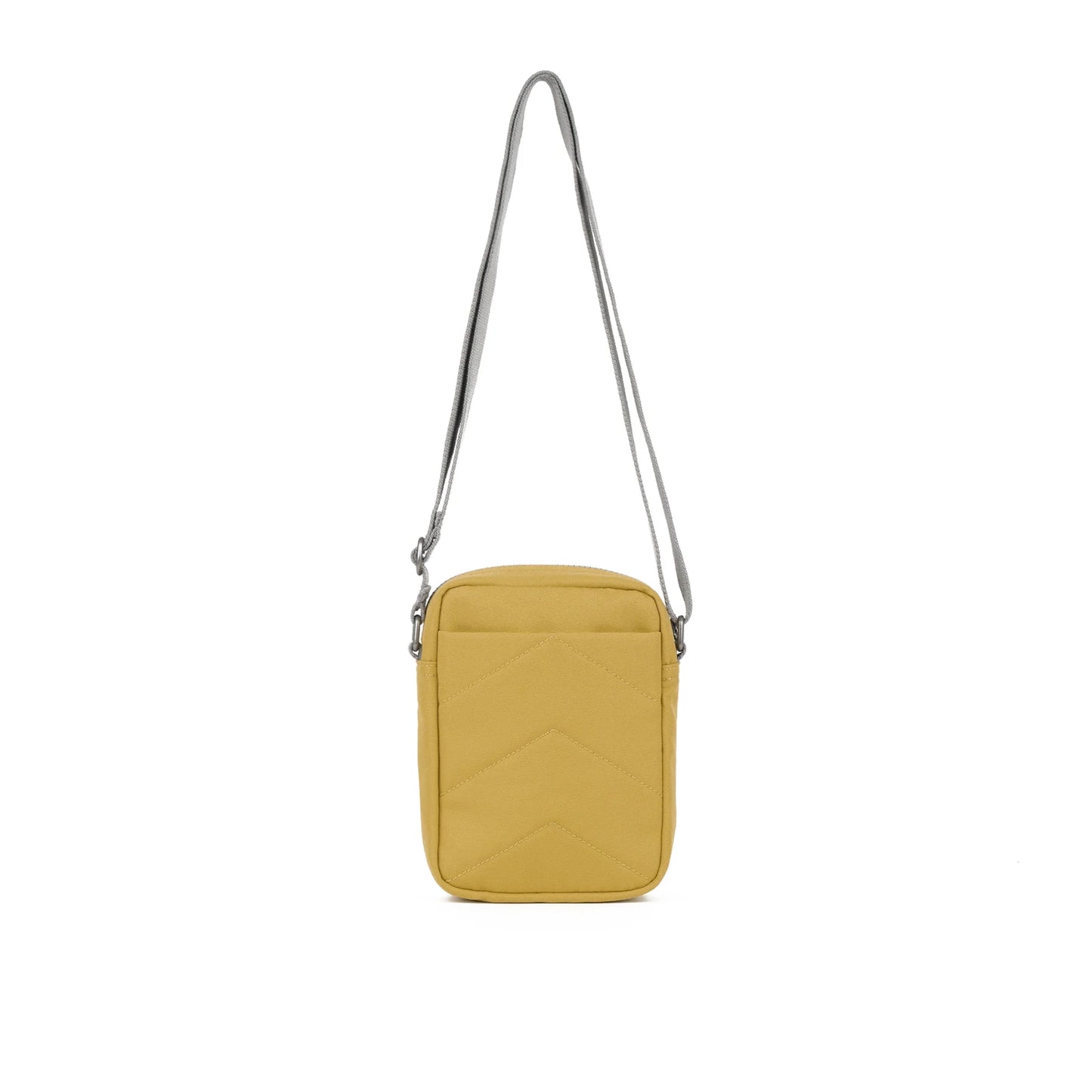 Reverse view of a small crossbody bag in canvas material and a khaki beige colour