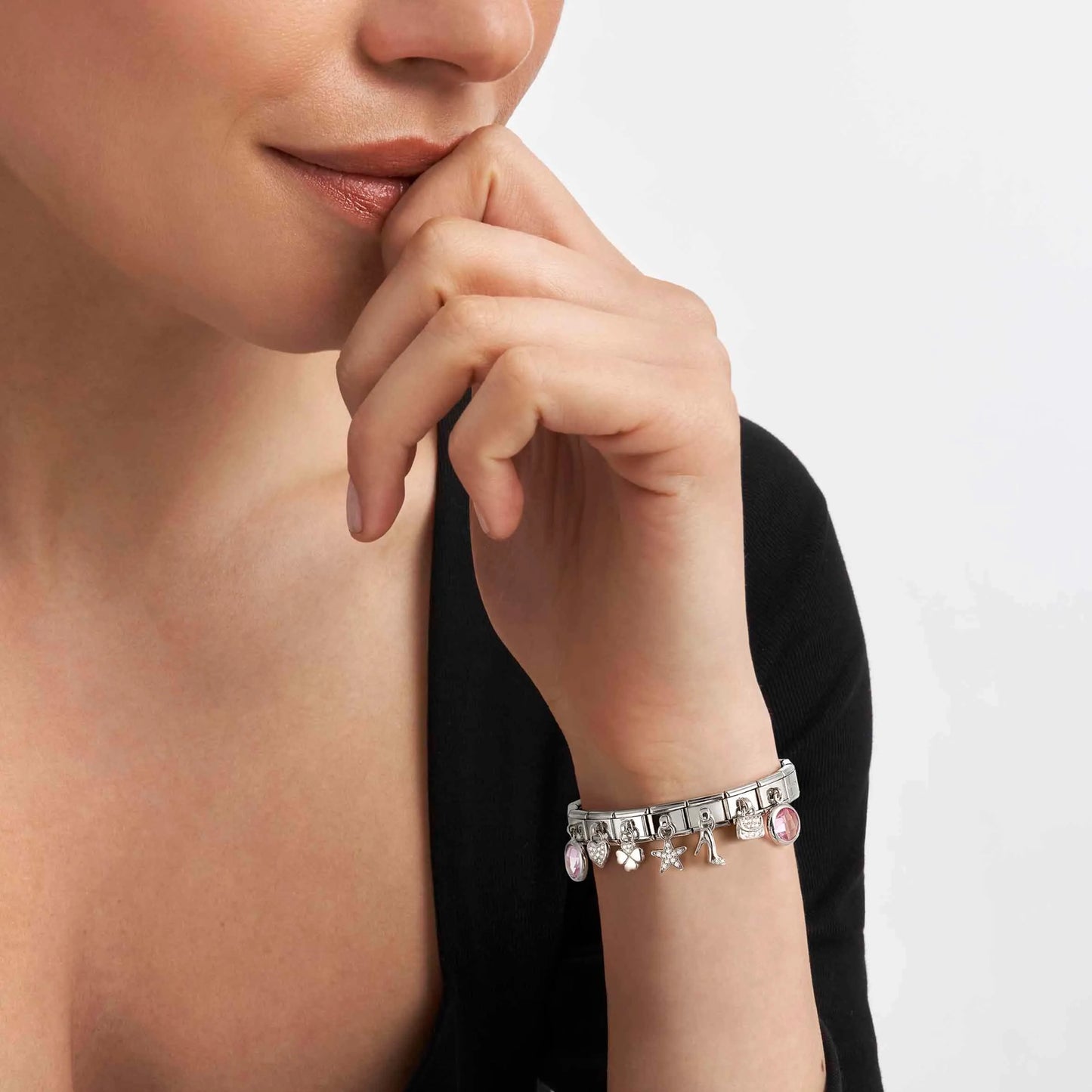 Model wearing bracelet of silver Nomination pendant
decorated links