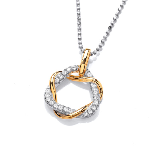 A round twist pendant with one gold band and one silver band with CZ stones