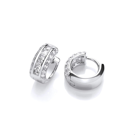 A pair of huggie hoop earrings featuring three rows of cubic zirconia stones