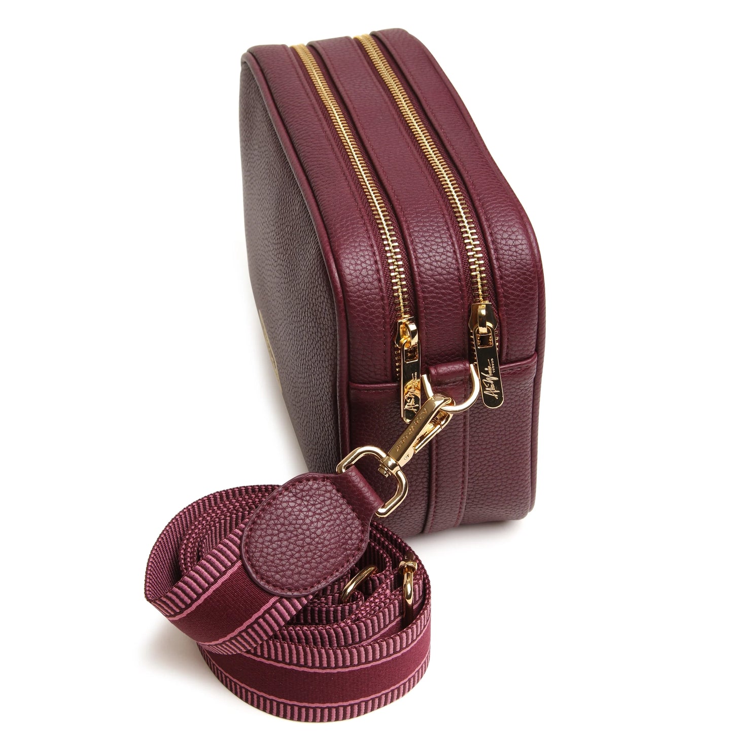 A berry red faux leather cross body bag