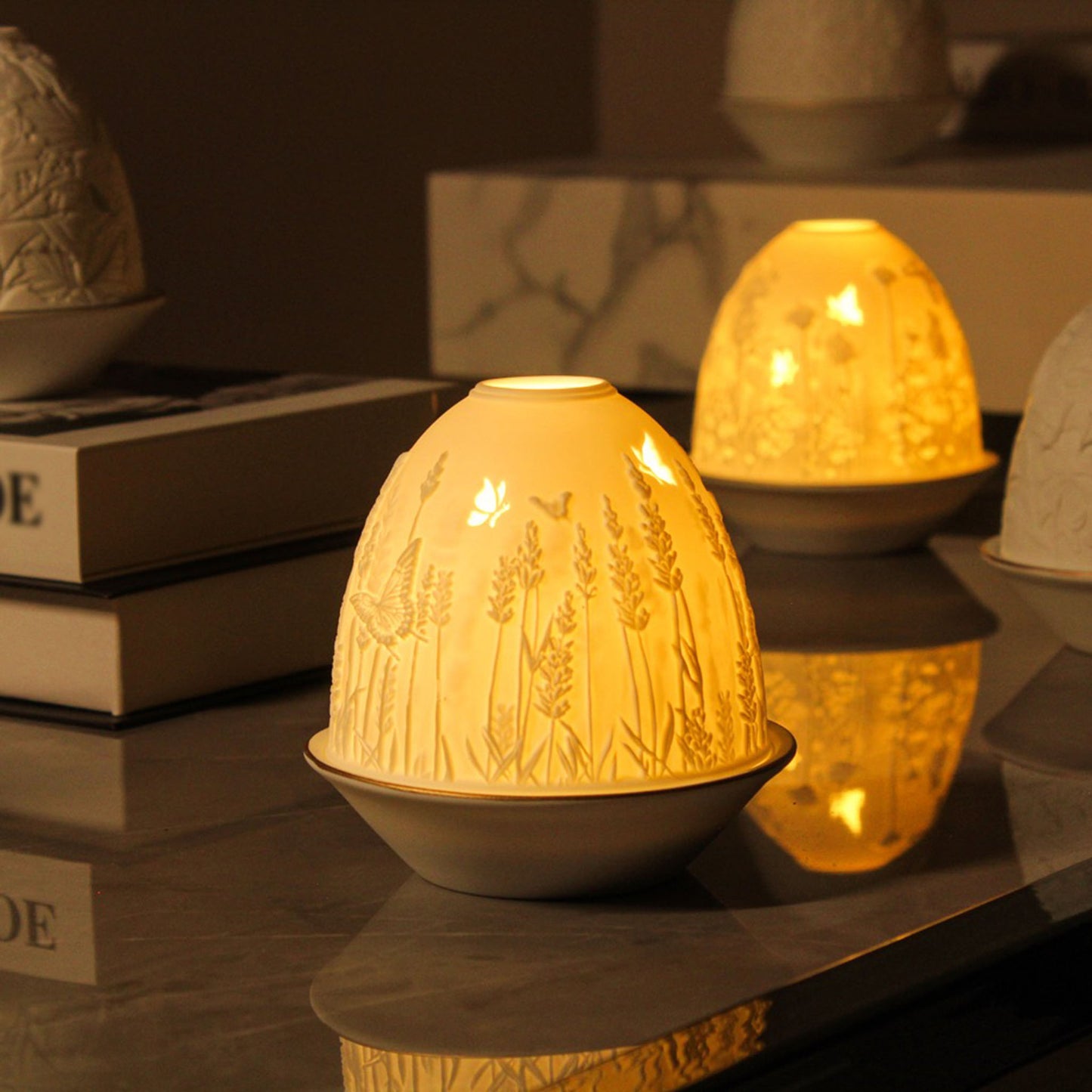 White porcelain tall dome candle holder with engraved lavender and gold rimmed plate lifestyle