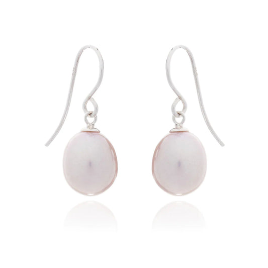 A pair of drop earrings with teardrop shaped pink pearls and silver hooks 