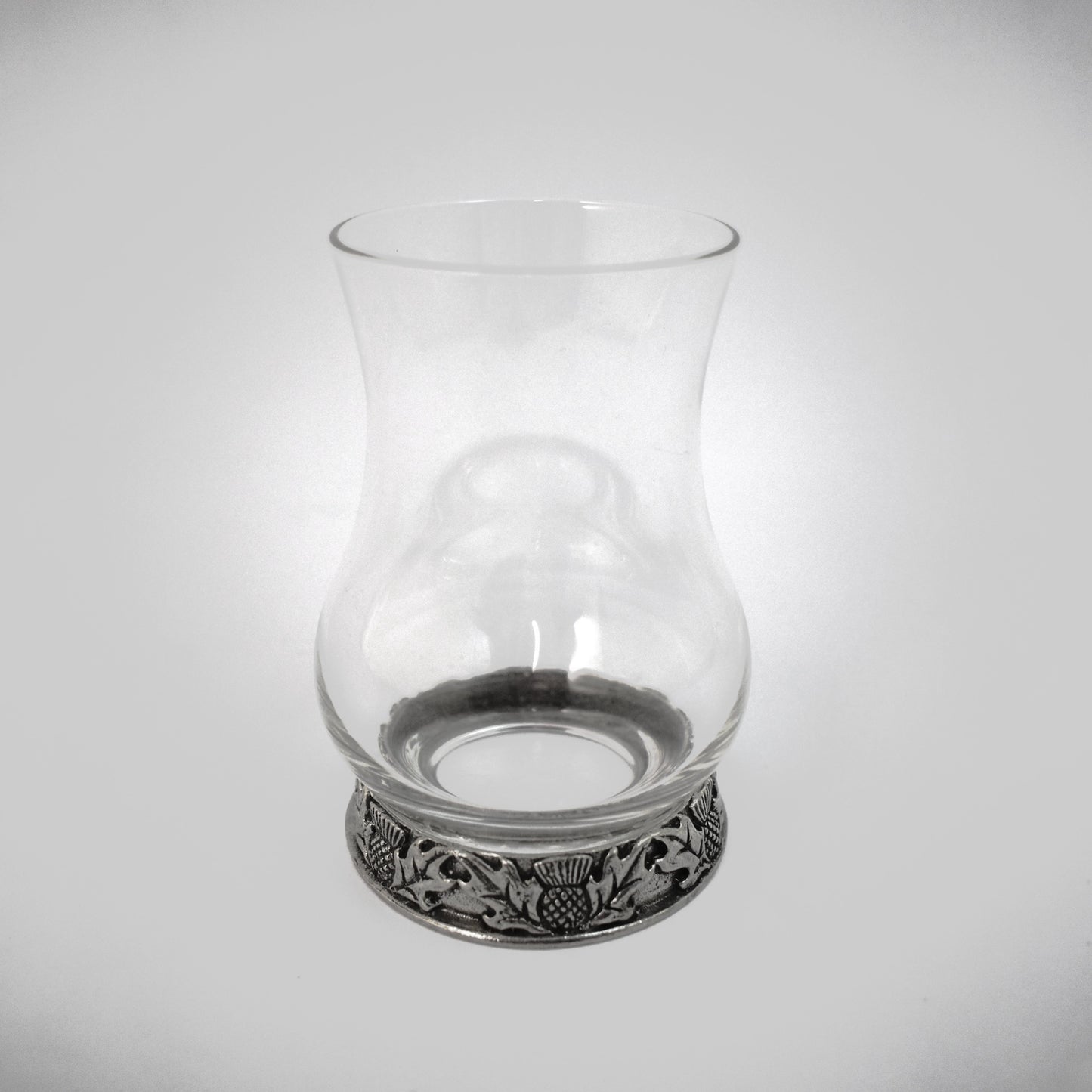 Glass whisky tasting glass with a pewter base featuring thistles