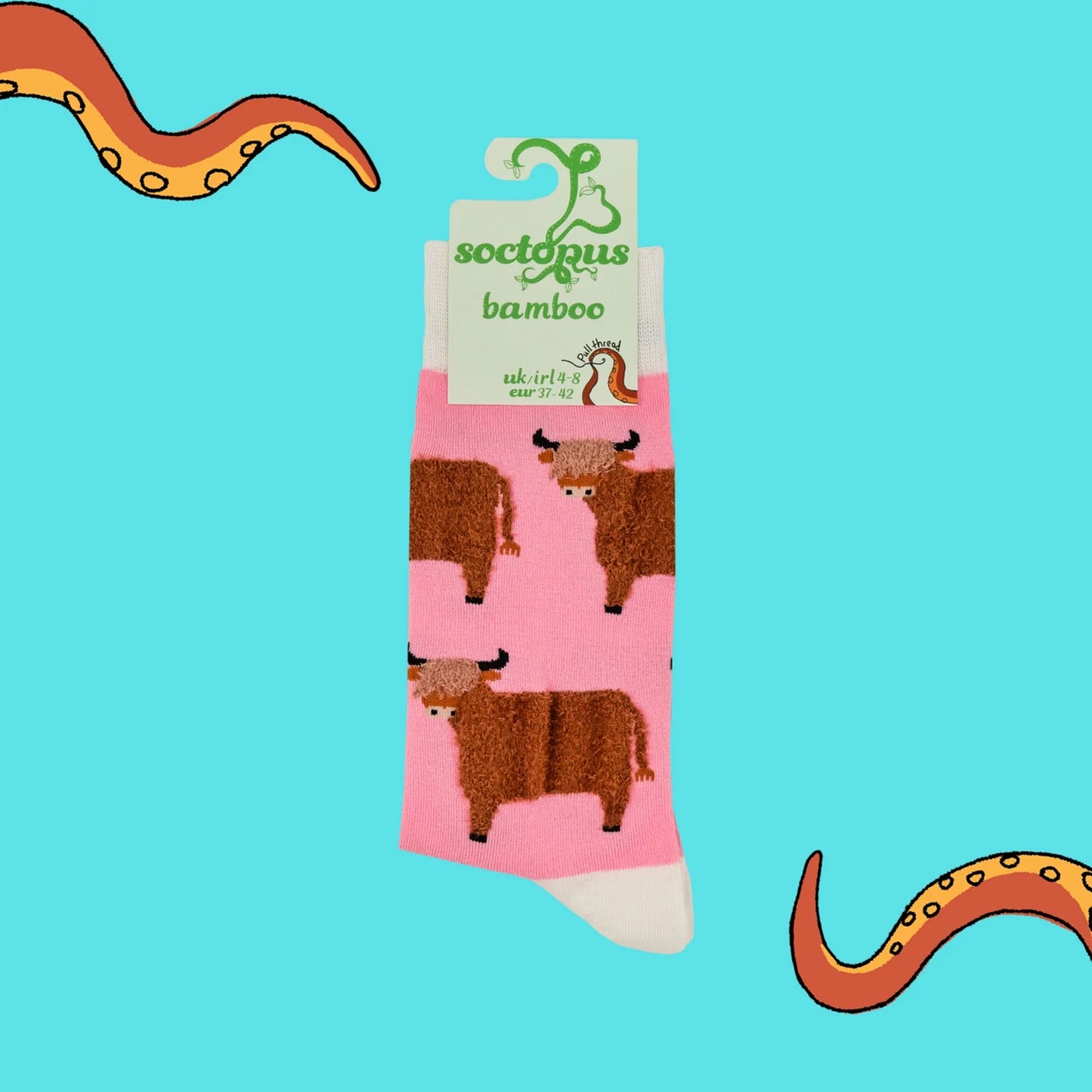 Pink socks with tufted Highland cows