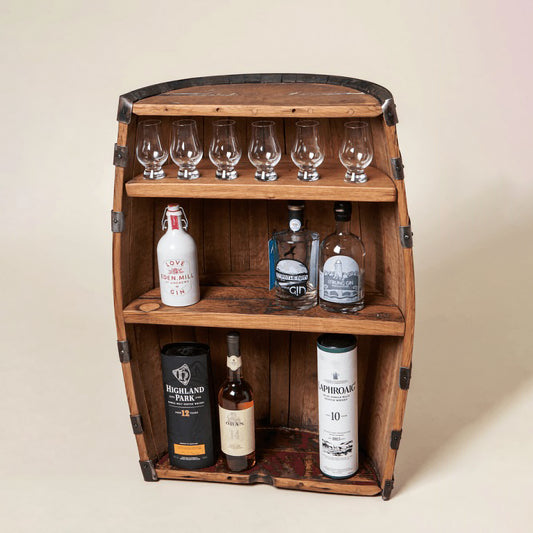 A half barrel shelved display unit with a mix of whisky and gin bottles