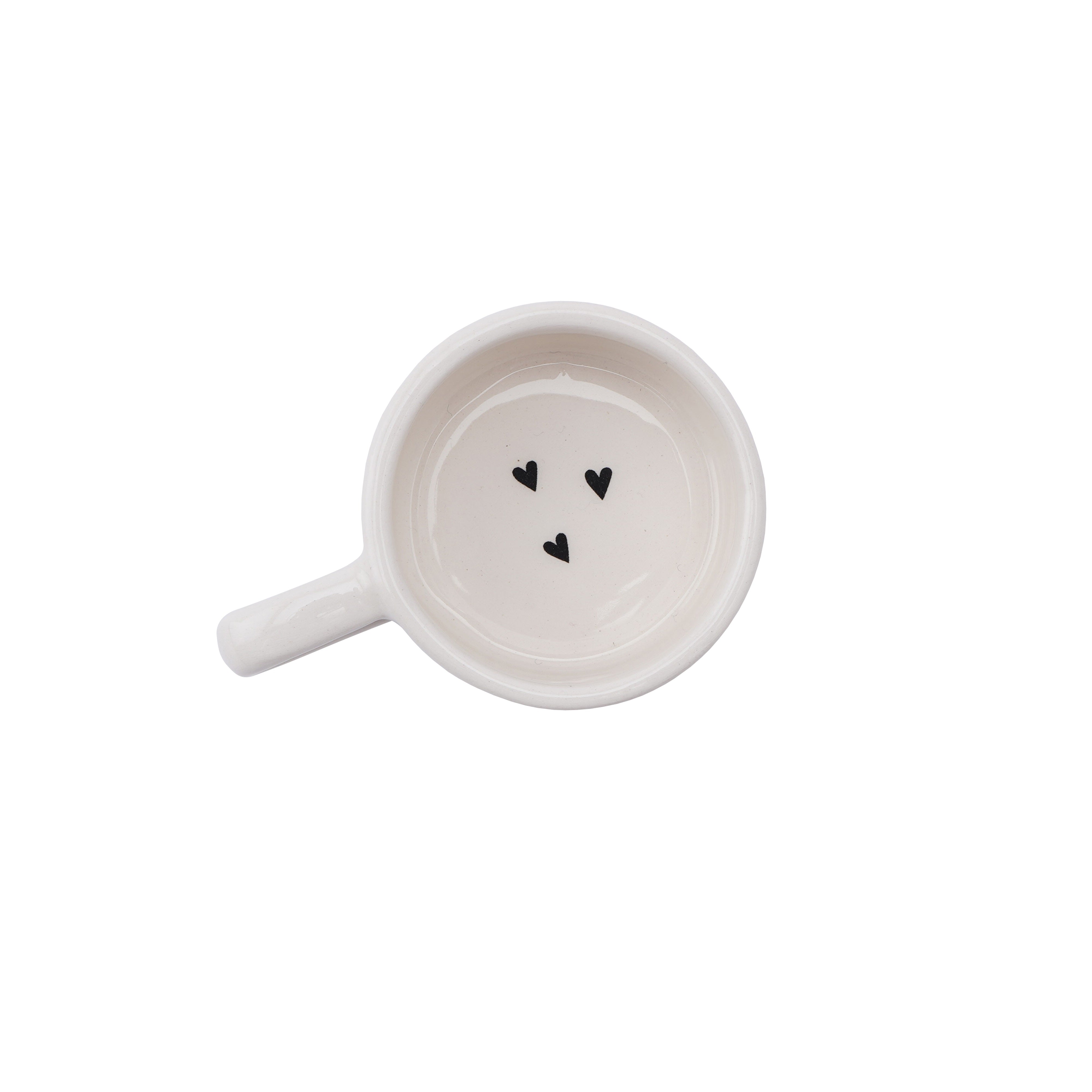 White mug shaped ceramic tealight holder with handle and heart pattern, with the phrase 'Happy days are here to stay'