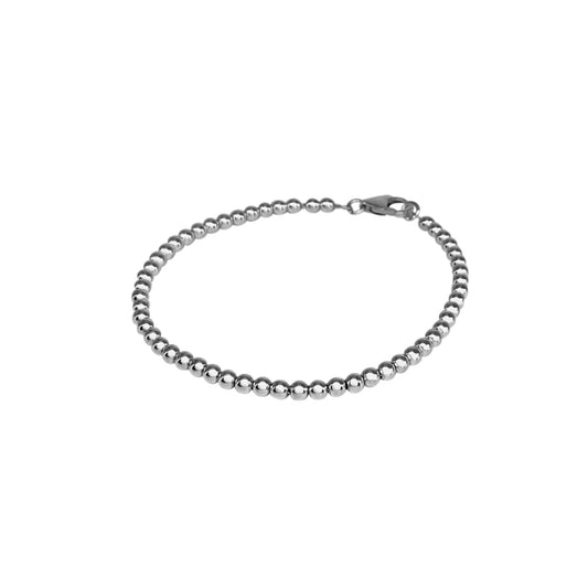 A simple silver bracelet with silver balls